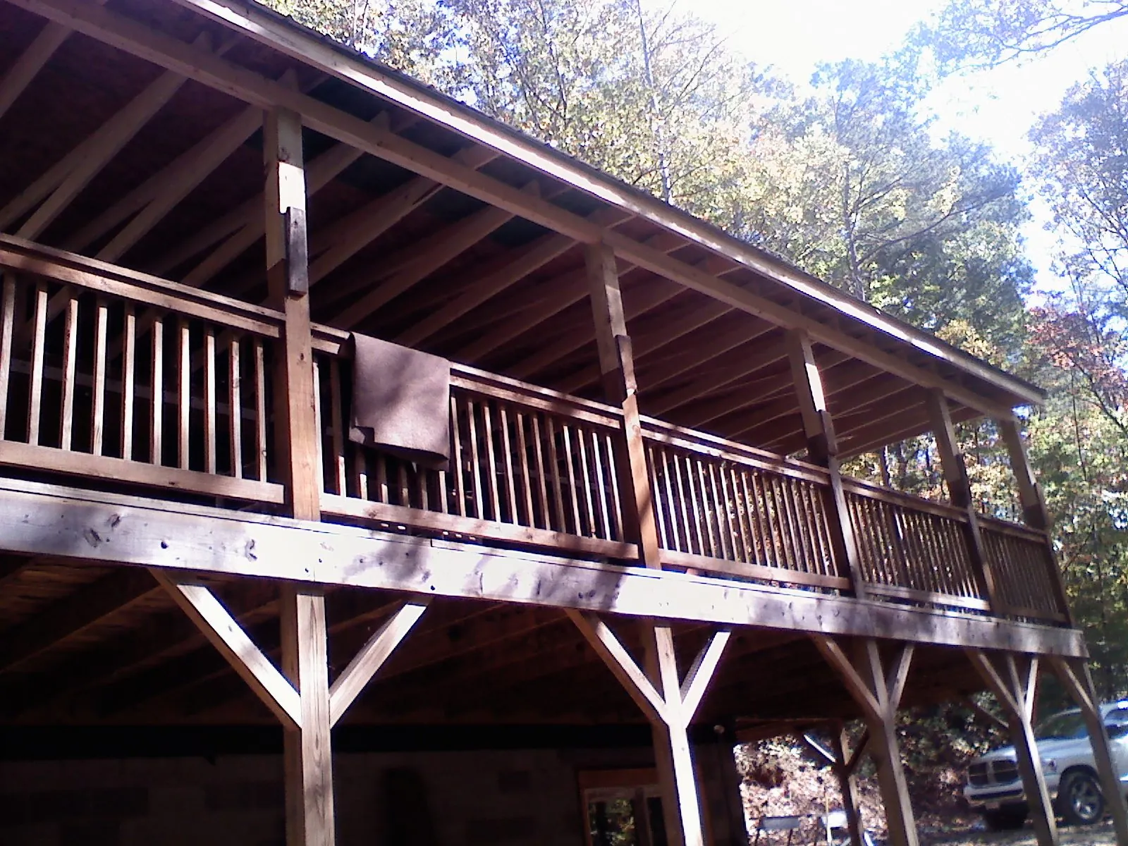 Timber framing under a new elevated porch and deck — Roof Leak Repair in West Oneonta by Roofing Brothers